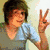 A person with brown hair appears in four showing different poses and clothing against light green or beige backgrounds