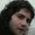 A pixelated image shows a person with dark curly hair on the left, and green text reading "JIM STURGESS 01 Veronica" on a black background to the right.
