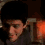 A four- shows a person with short dark hair in various poses against a dimly lit interior background