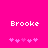 Bright pink background with white pixelated text 'Brooke' above two of pink pixelated heart symbols