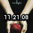 Two hands hold a red apple against a black background with date and text overlays.