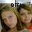Two women with light brown hair pose closely together in a pixelated image, one wearing red clothing.