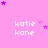 Pink background with repeated 'katie kane' text and purple star clusters in pixelated style.
