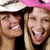 A 50x50 pixel animated buddy icon featuring two smiling women on the left and pink pixelated text "REAL WORLD" on the right, displayed as a contact sheet with two frames.