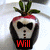 A strawberry-shaped figure with a bow tie and buttons, displaying text that changes from 'Will' to 'you' then 'marry me?' in red.