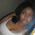 A person in a white tank top with dark hair, shown in a of four with slight variations in pose and expression