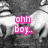 Black-and-white image of a person with closed eyes and hands near face, overlaid with pink pixelated text in two sections.