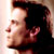 Pixelated static image of a person's profile with dark hair and light skin tone, cropped to show only the head and upper neck against a plain background.