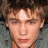 Pixelated image of a person with light brown hair and fair skin, next to green text on dark background.