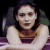 A pixelated image of a woman with dark hair in a sleeveless top, positioned next to green text reading 'Original Icons .com' on a solid background.