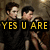 Animated image of three figures in a dimly lit setting with text overlays changing from "YES U ARE" to "DAZZLED!"