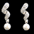 Animated sequence showing four variations of earrings: white pearl-like with black background, same pearls on gray background, blue teardrop earrings with 'love' text overlay, and pink gemstone earrings with 'earrings' text overlay.
