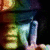 Pixelated image showing a person in green shorts and dark shirt holding an object, with 'peace<3' text on yellow background.