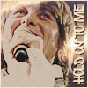 A person with light brown hair sings into a microphone, with text reading 'HOLD ON TO ME' vertically on the right side.