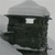 Pixelated grayscale icon shows a dark rounded shape with a light rectangular window and a lighter top section against a gray background.