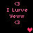 Pixelated pink text and symbols on black background with animated heart icons appearing in different positions.