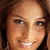 A four- shows a person with brown hair and light skin smiling, wearing earrings; the right is blank