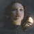 A 4-frame contact sheet of a dark-haired woman in a black top with glowing golden circular objects near her shoulder, displayed on a gray background.