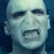 Pixelated image of a pale-skinned figure with dark eyes and mouth open in a grimace, next to black text reading 'rawr.' on white background.
