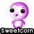 Pixelated purple character with large black eyes and a small mouth, standing above text reading 'Sweetcorn' on a white background.