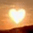 A split-screen animated buddy icon featuring a heart-shaped sunset on the left and yellow pixelated text reading "Lets Watch The Sunset <3" on the right against a black background.