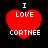 Four identical red heart-shaped icons with white text 'I LOVE CORTHEE' on black background, arranged in a