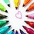 Colorful pencil and marker icons arranged in a radial pattern around a central heart outline on a white background.