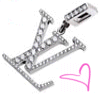 A stylized silver 'LV' monogram with embedded white dots, accompanied by a pink heart outline on a white background.