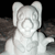Pixelated grayscale image of a stylized animal head with large rounded ears, a circular nose, and a smooth face against a dark background.