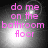 Four identical display pink text reading "do me on the bathroom floor" over a grayscale background with bright light effects