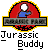 Pixelated red circular icon with blue and white elements, featuring a 'Jurassic Park' banner above text reading 'Jurassic Buddy', animated changes in the lower section.