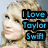 Pixelated image of a person with light brown hair, featuring two text blocks: blue 'I Love Taylor Swift' and purple 'Taylor is the 'Flippen' Best Singer!' on black backgrounds.