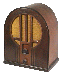 Four views of a vintage radio with arched top, brown wooden casing, and glowing orange speaker grille.