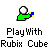 Green hand holding white ball with blue-yellow cube, repeated three times per on gray background, text below reads "Play With Rubix Cube"