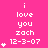 A static pink background displays repeated white text 'i love you zach 12-3-07' with varying numbers of small white heart symbols above the date.