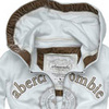 Static image of a light gray hoodie with brown trim on the hood and zipper, featuring 'abercrombie' text on the left chest and 'fitch' on the right chest, with a small logo below the zipper.