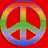 A static image showing a rainbow-colored peace symbol on red background, pink heart with black splatter effect, and partial portrait of smiling woman with brown hair.