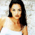 A 50x50 pixel buddy icon split into two frames showing a woman in a white top on the left and green text "Original Icons .com" on the right, with visible pixelation and dithering effects.