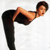 A pixelated figure in a black outfit performs a high kick with one leg extended upward and the other leg bent, set against a plain white background.