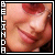 Pixelated close-up of a person's face with closed eyes and red lips, bordered by vertical white text reading BELINDA on the left.