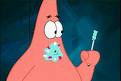 Static cartoon image of a pink starfish character holding a toothbrush with bubbles in its mouth against a dark blue background.
