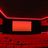 A pixelated static image with a central orange rectangle bordered by dark and red tones, featuring a diagonal pinkish streak on the left.