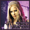 A static image of a person with long light brown hair wearing a silver tiara, dark clothing, and purple background with text overlay.