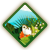 Pixelated diamond-shaped icon with green border, light blue mountain peak, green foliage, white house with brown roof, and orange flower-like shape on grassy foreground.