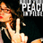 Pixelated image of a person with long brown hair making an obscene gesture, set against dark background with partial text reading "PEAC" and "MIL".