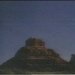 Static 75x75 pixel icon depicting a mountain silhouette against a gradient sky with visible dithering and low-resolution rendering artifacts.
