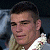 A pixelated image shows a person with short dark hair and light skin wearing a white shirt, next to green text reading 'Original Icons .com' on a solid background.