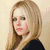 five pixelated images showing a person with long blonde hair in various poses and expressions, including a central pink square with text