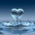 Animated heart-shaped water droplet rising from rippled surface against gradient blue background.