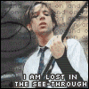 showing a person in a white shirt and dark tie holding a guitar strap, with text changing across the bottom